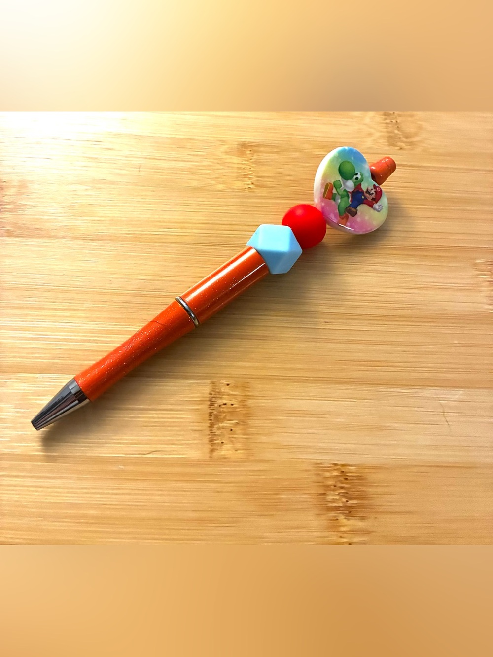 Character Themed Orange Beaded Pen with Blue and Red Accents